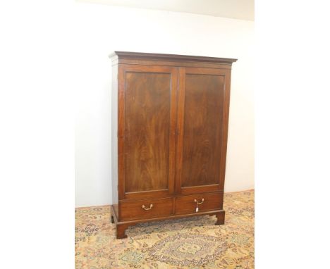 George III linen press with dentil cornice, the interior now converted to hanging space enclosed by a pair of panel doors abo