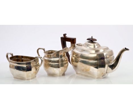 1930s silver three piece tea set, comprising teapot of shaped octagonal form, with faceted panels, angular stained wood handl