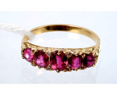 Victorian ruby five stone ring with five graduated oval mixed cut rubies with rose cut diamond accents to the claws, with car