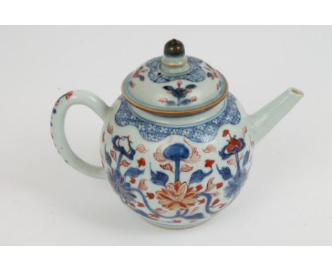 18th century Chinese Imari teapot and cover of bullet form, with strap handle, the domed cover with knop finial, 14cm high.  