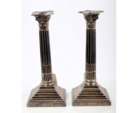 Pair Victorian silver ten inch Corinthian column candlesticks, with beaded borders, on square stepped bases (London 1894), He