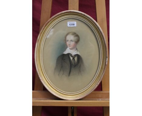 F. Geere, late Victorian oval chalk portrait of a young man, signed and dated 1901, in oval gilt frame, 33cm x 25cm