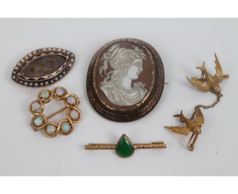 Group of five antique brooches, to include George III seed pearl and enamel oval brooch, Victorian cameo brooch in yellow met