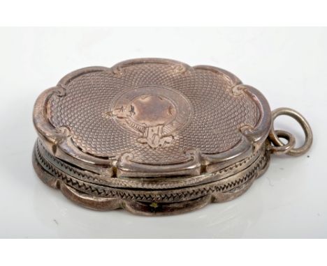 Victorian silver vinaigrette of oval form, with engine-turned decoration and scroll borders, suspension ring and hinged cover