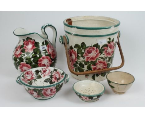 Early 20th century Wemyss pottery toilet ware with painted pink rose and green leaf decoration, comprising wash jug, slops pa