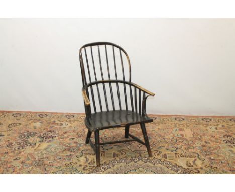 Unusual 19th century oak and elm primitive stick back elbow chair with high arched back and outswept arms having broad shaped