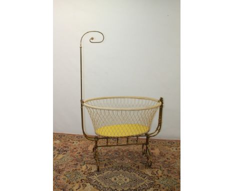 19th century French babies' cradle, the oval swinging basket raised on column supports and colonnade understructure on unders