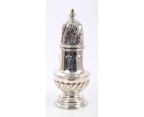 Victorian silver sugar caster of compressed baluster form, with wrythen decoration, separate pierced cover with urn finial, o