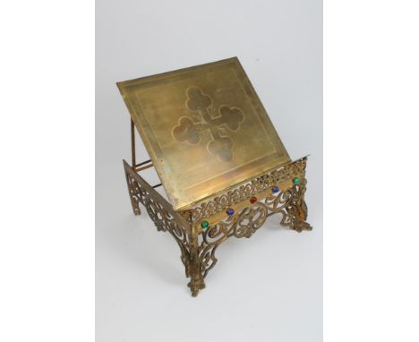 Victorian brass bible stand, the cruciform etched top with slanted rear gallery raised on pierced scrolling, bracket sides wi