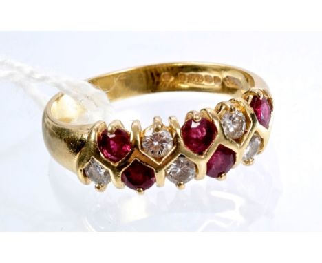 Ruby and diamond half hoop ring with two lines of brilliant cut diamonds and mixed cut rubies in an alternating design in gol