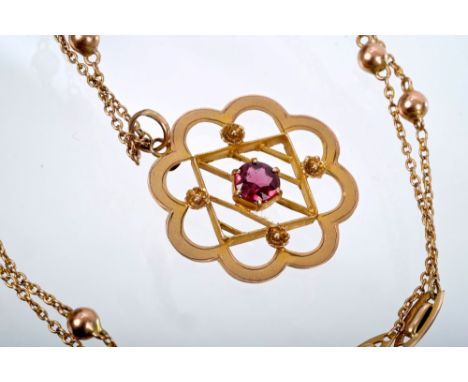 Edwardian gold (9ct) garnet pendant with flower-shape border, on fancy link chain CONDITION REPORT Pendant - very good condit