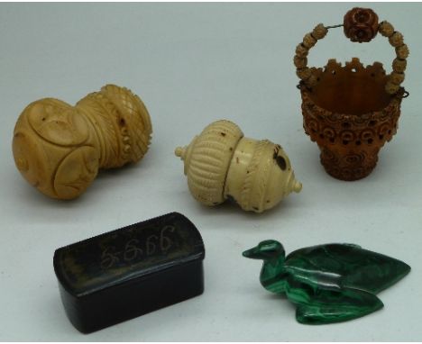 Two carved spice boxes, a papier mache snuff box, a carved cocoa nut in the form of a basket and a malachite bird