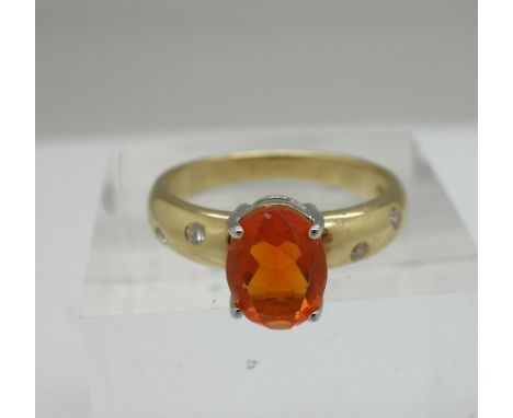 An 18ct gold, fire opal and diamond ring, weight 5.6g, size O/P