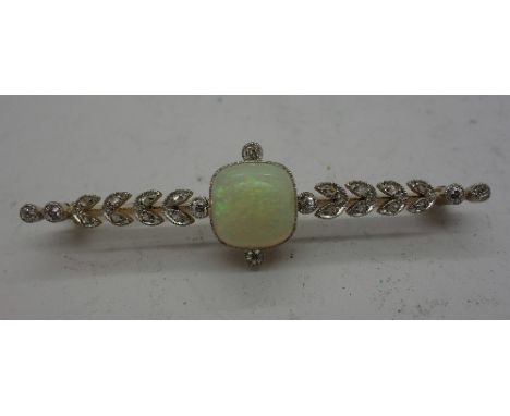 A yellow metal Art Deco opal and diamond brooch, cased