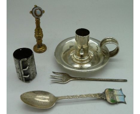 A Victorian silver chamber stick, Chester 1896, a silver spoon, two other silver items, a/f, and a hardstone set claw seal