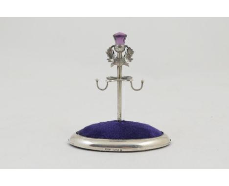 Edwardian silver Scottish themed hat pin stand and ring tree, Birmingham 1909, centred with a thistle form with amethyst colo
