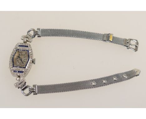 Lady's vintage diamond and sapphire cocktail watch, circa 1925, the tonneau shaped case bordered with small brilliants and ba