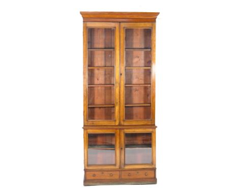 Victorian mahogany library bookcase, moulded cornice over two plain glazed doors opening to five adjustable shelves, over a b