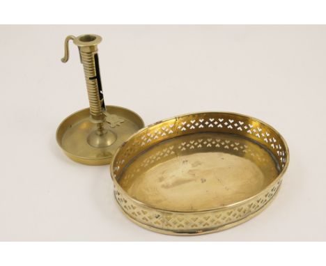 Victorian brass galleried tray, oval form pierced with heart shapes, 25cm; also a brass adjustable chamber stick, 8cm (2)