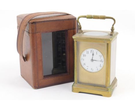 French brass carriage clock, white enamelled dial with Arabic numerals, the movement chiming on a gong, height 14.5cm, within