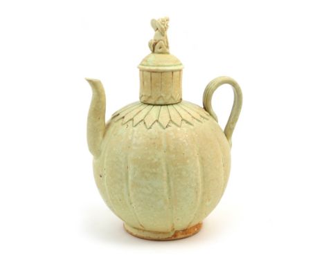 Yue ware teapot and cover, probably Korean or Chinese Northern Dynasties, of rounded form carved at the neck with a band of f