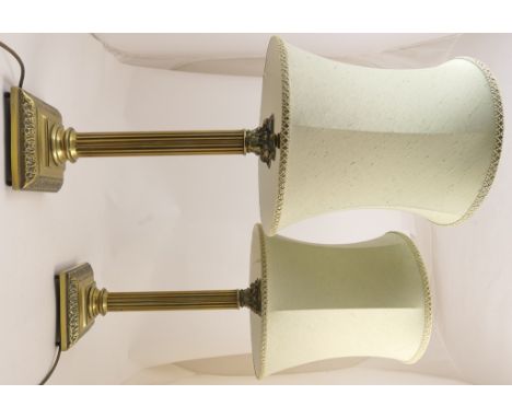 Pair of brass Corinthian column table lamps, with pale green fabric shades, height to the light bulb fitting 50cm