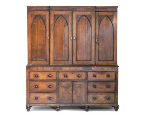 Late George III oak and mahogany housekeeper's cupboard, circa 1800-20 with later additions, the breakfront top fitted with f