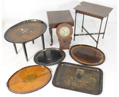 A mixed lot, comprising two inlaid wooden oval serving trays, one in satinwood, the other mahogany; two Regency toleware serv