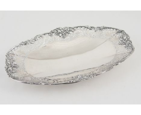 Silver fruit bowl, maker FC, Sheffield 1969, elongated oval form with pierced vine leaf and fruiting vine border, raised on a