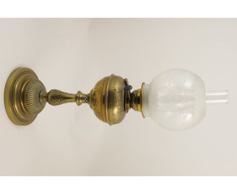 Victorian brass pedestal oil lamp, with a frosted clear glass shade, over a brass tank, column and stepped circular base, hei