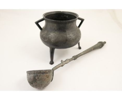 Iranian metal cauldron, traditional form having a baluster body with twin handles, engraved with a band of foliage, raised on