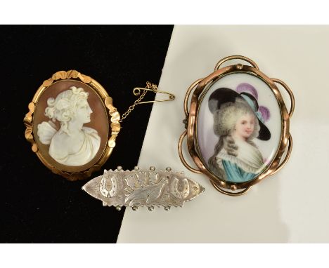 THREE BROOCHES, to include a Victorian silver floral and horse shoe embossed brooch, beaded edge, hallmarked Birmingham 1890,