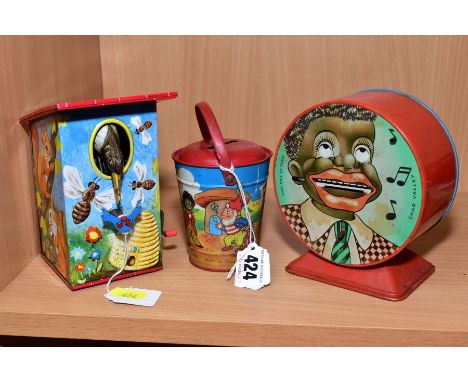 A CHAD VALLEY TINPLATE NODDY MONEY BOX, in the form of a bucket with multicoloured lithographed design, missing key, with a C