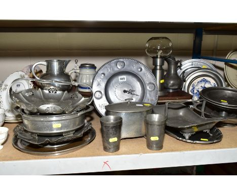 A COLLECTION OF PEWTER, including baskets, plates, comports, tumblers, pitchers, tea caddy and cover, lace makers style lamp 