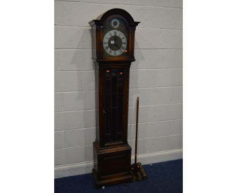 AN EARLY TO MID 20TH CENTURY OAK LONGCASE CLOCK, arched glass door enclosing a brass and silvered dial, the arch with a dial 