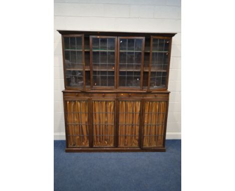 AN EARLY TO MID 20TH CENTURY OAK BOOKCASE, with a fixed cornice, four lead glazed doors enclosing two fixed shelves supported