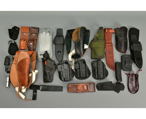 A COLLECTION OF HOLSTERS AND LEATHER ITEMS comprising of two unnamed leather shoulder holsters, three Fobus plastic holsters 