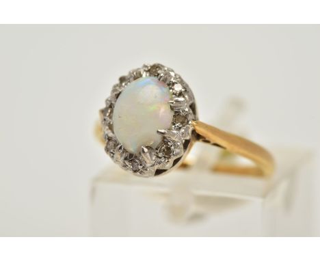 AN 18CT GOLD OPAL AND DIAMOND CLUSTER RING, designed with an oval opal cabochon, single cut diamond surround, tapered shoulde