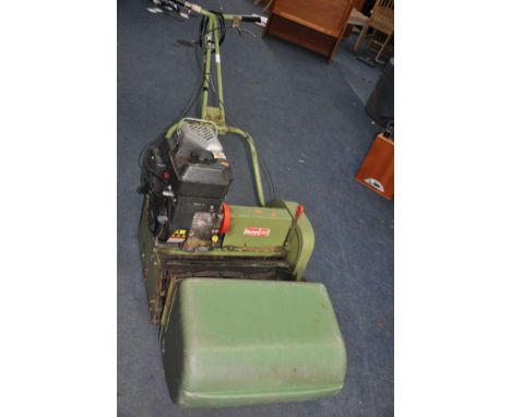 A VINTAGE HAYTER 20 PETROL CYLINDER MOWER with 20 inch cut and grass box (engine pulls freely but not started)