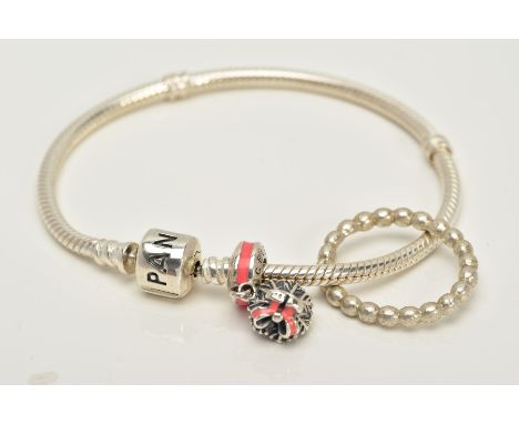 A PANDORA CHARM BRACELET AND WHITE METAL RING, the snake bracelet suspending a bouquet of flowers 'Celebration' charm with pi
