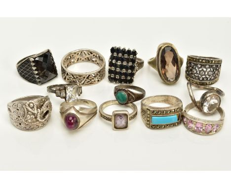 A SELECTION OF WHITE METAL RINGS, to include thirteen rings of various designs such as a rectangular shape ring set with oval