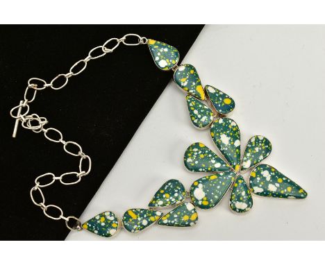 A LARGE WHITE METAL ABSTRACT NECKLACE, designed with green, white and yellow enamel tear drop panels, stamped 925, fitted to 