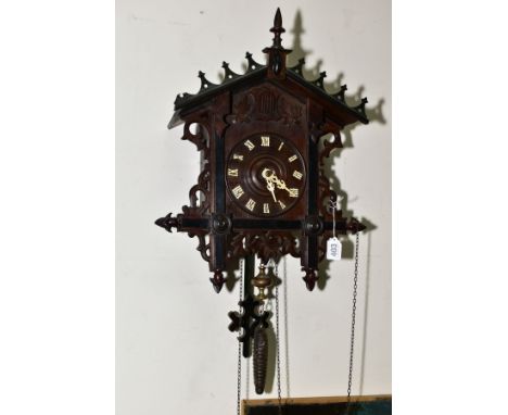 AN EARLY TWENTIETH CENTURY BLACK FOREST STYLE CUCKOO CLOCK, pierced pediment and sides, wooden dial with roman numerals, with
