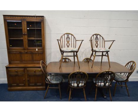 A ERCOL (GOLDEN DAWN) DINING SUITE, comprising an extending table, with a single fold out leaf, extended length 204cm x close