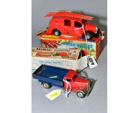 A BOXED TRI-ANG MINIC FIRE ENGINE, NO. 62M, lightly play worn condition, with both ladders (warped), hose pipe present but ha