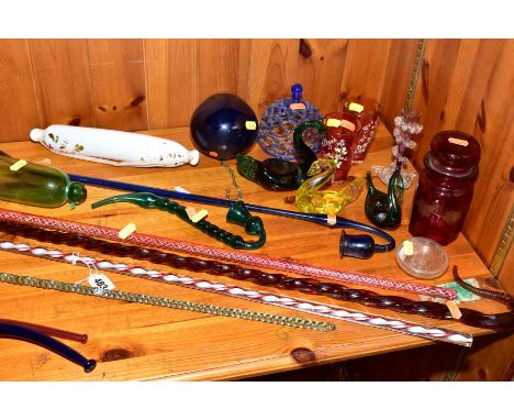A GROUP OF COLOURED GLASSWARES, to include 19th century and later frigger glass walking canes with plain amber, light blue an