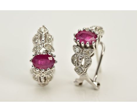 A MODERN PAIR OF FANCY RUBY AND DIAMOND STUD EARRINGS, fitting to an Omega post fitting, estimated modern round brilliant cut