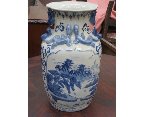 CHINESE RELIEF DECORATED BLUE AND WHITE CERAMIC VASE, APPROXIMATELY 36cm HIGH 