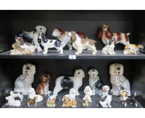 LARGE QUANTITY OF GLAZED AND UNGLAZED CERAMIC DOGS INCLUDING BESWICK