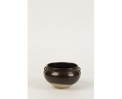 A CHINESE BROWN-GLAZE BOWL, the baluster sides decorated in a rich brown glaze with twin scroll handles, Song dynasty, 14cms 